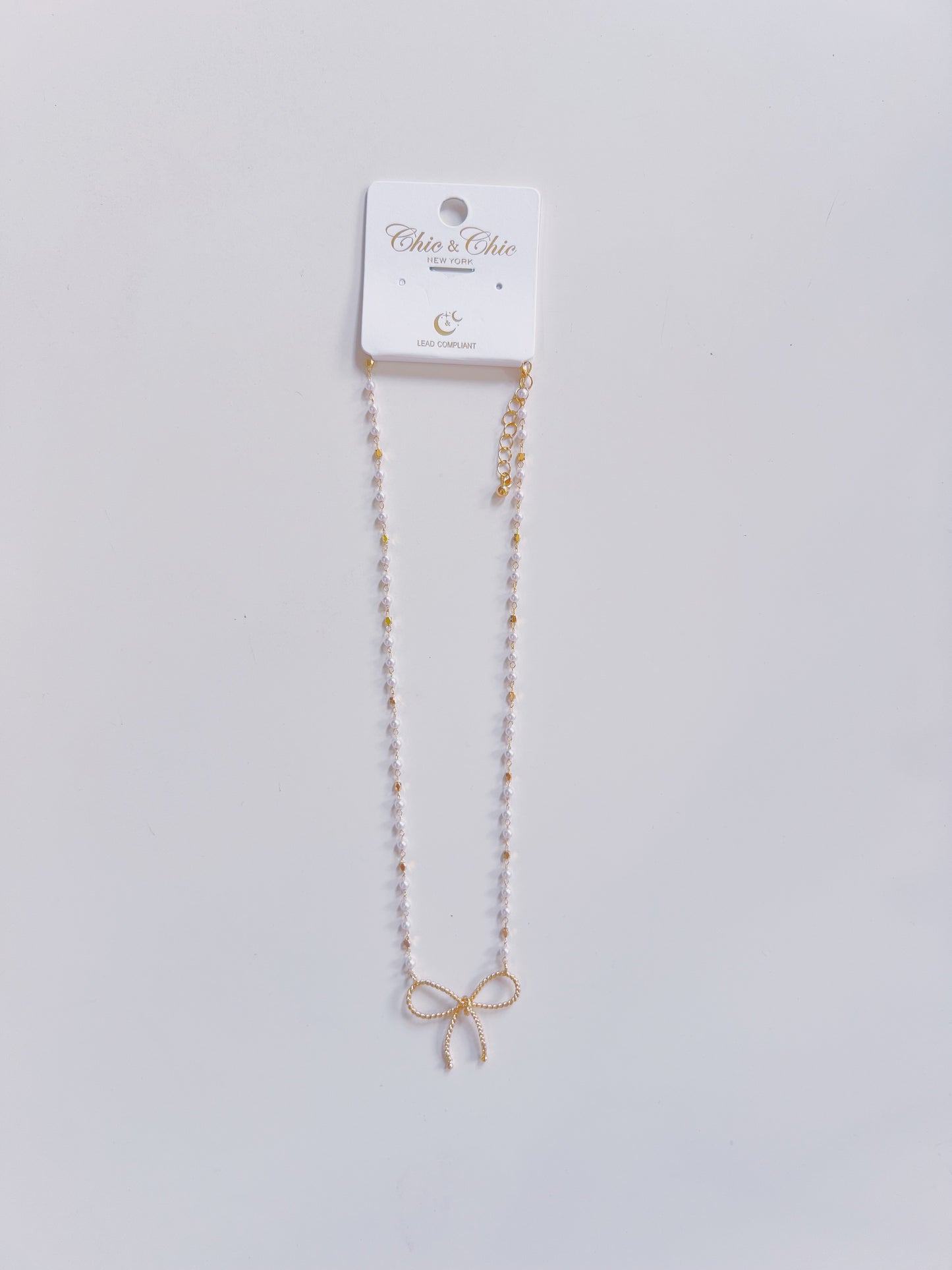 Gold Textured Bow & Pearl Chain Necklace
