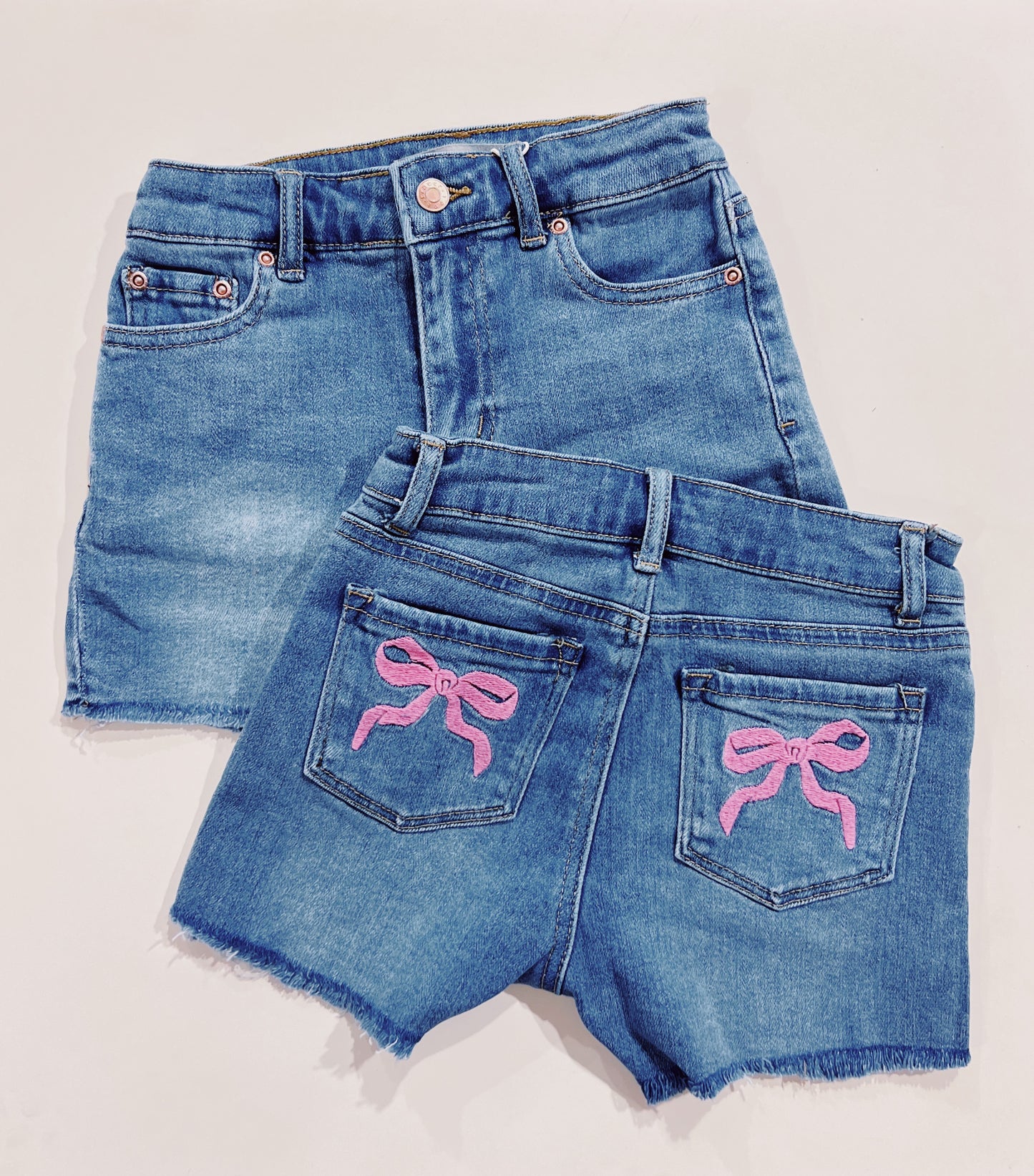 Tractr Indigo Raw Edge Pink Bow Pocket Denim Shorts